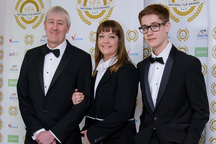 Nicholas Lyndhurst, Lucy Smith and Archie Lyndhurst pose for a photo in formal attire