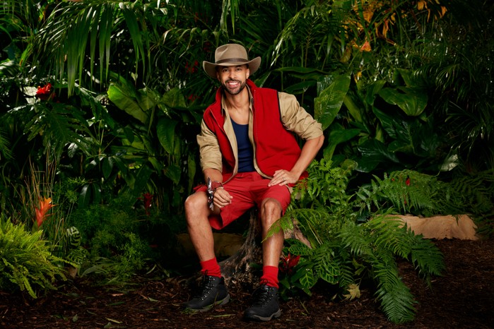 I'm a Celebrity 2023 contestant Marvin Humes wearing his camp gear as he poses in front of some trees ahead of 2023 show