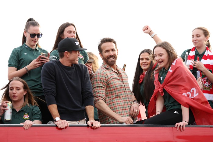 Rob McElhenney and Ryan Reynolds celebrate with Wrexham AFC fans