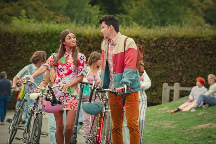 Mimi Keene as Ruby and Asa Butterfield as Otis in Sex Education Season 4 walking together with bicycles