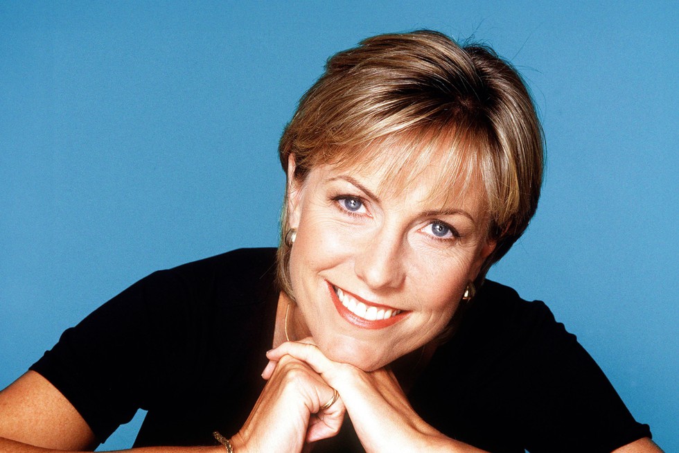 Jill Dando smiling with her hands under her chin