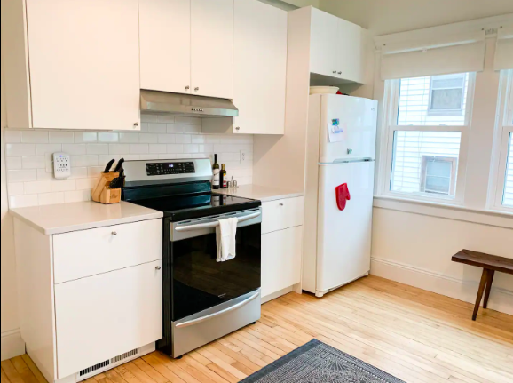 Inexpensive Induction range in white kitchen - photo 